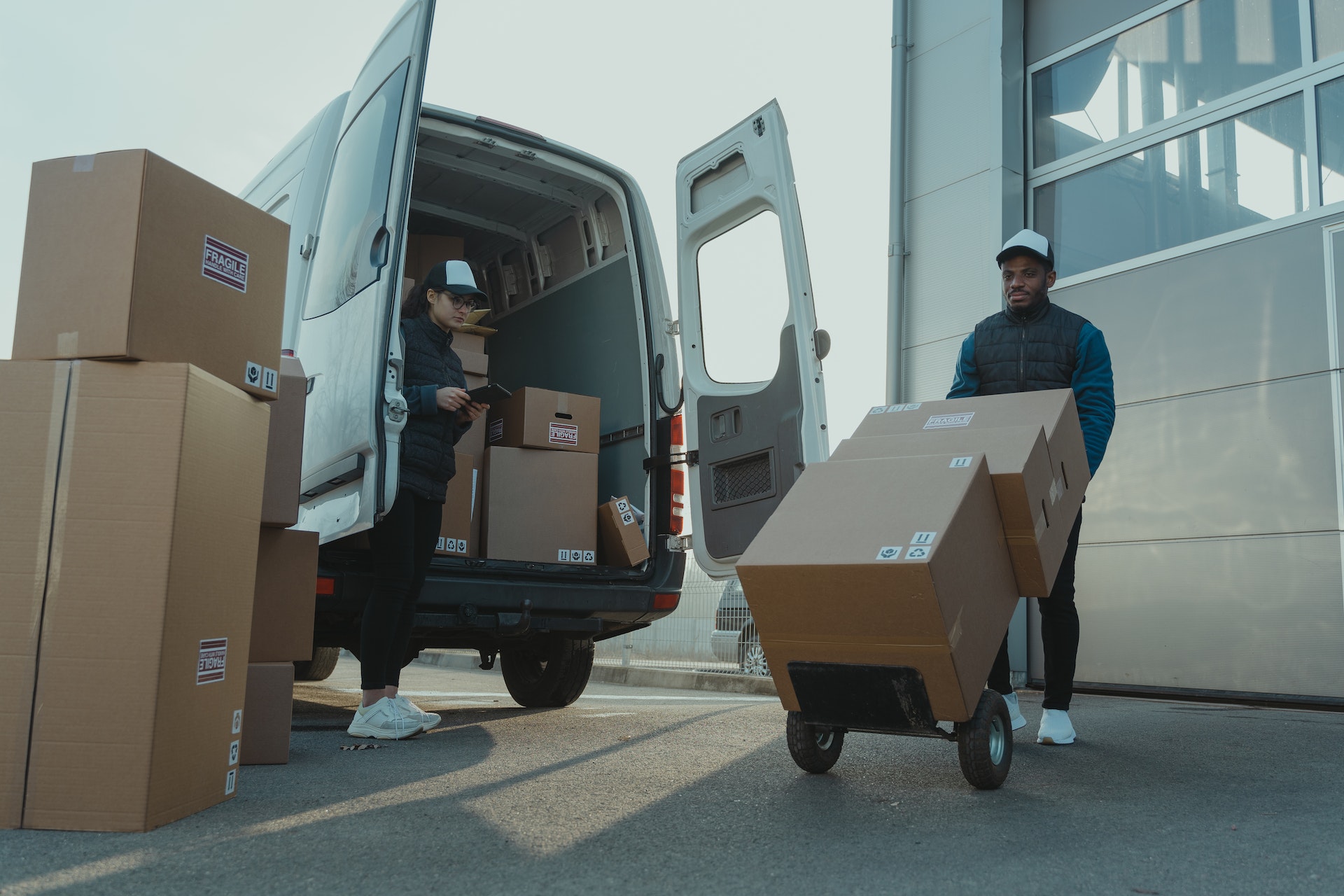 https://www.pexels.com/photo/a-man-and-a-woman-working-for-a-delivery-company-6169668/